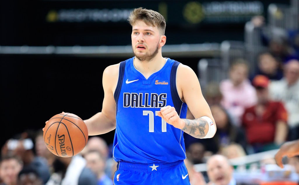 INDIANAPOLIS, IN - JANUARY 19: Luka Doncic # 77 of the Dallas Mavericks bounces the ball against the Indiana Pacers at Bankers Life Fieldhouse on January 19, 2019 in Indianapolis, Indiana. NOTE TO USER: The user expressly acknowledges and accepts that, by downloading and / or using this photograph, the User accepts the terms and conditions of the Getty Images License Agreement. (Photo by Andy Lyons / Getty Images)
